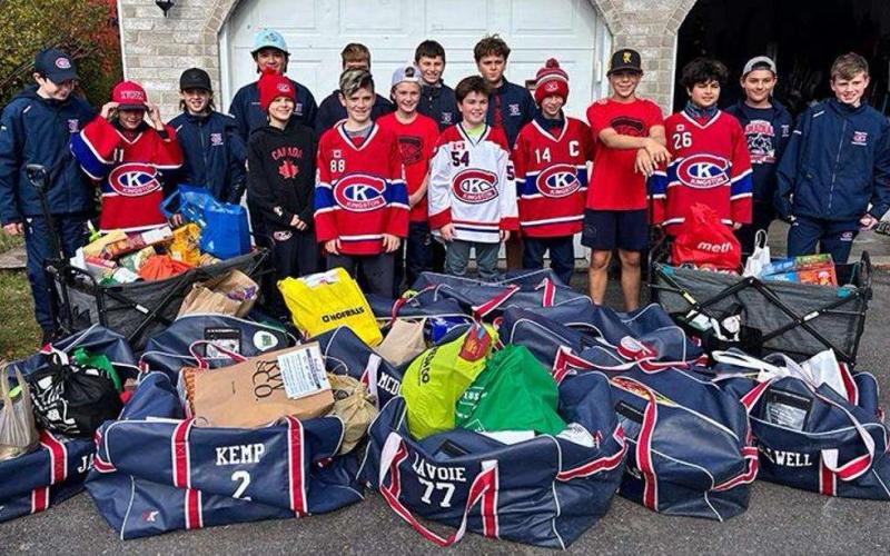 Team with hockey bags of food